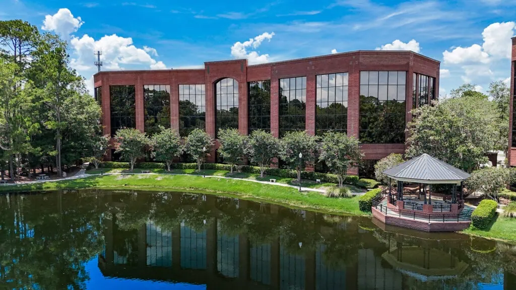 An image of an industrial building by the water