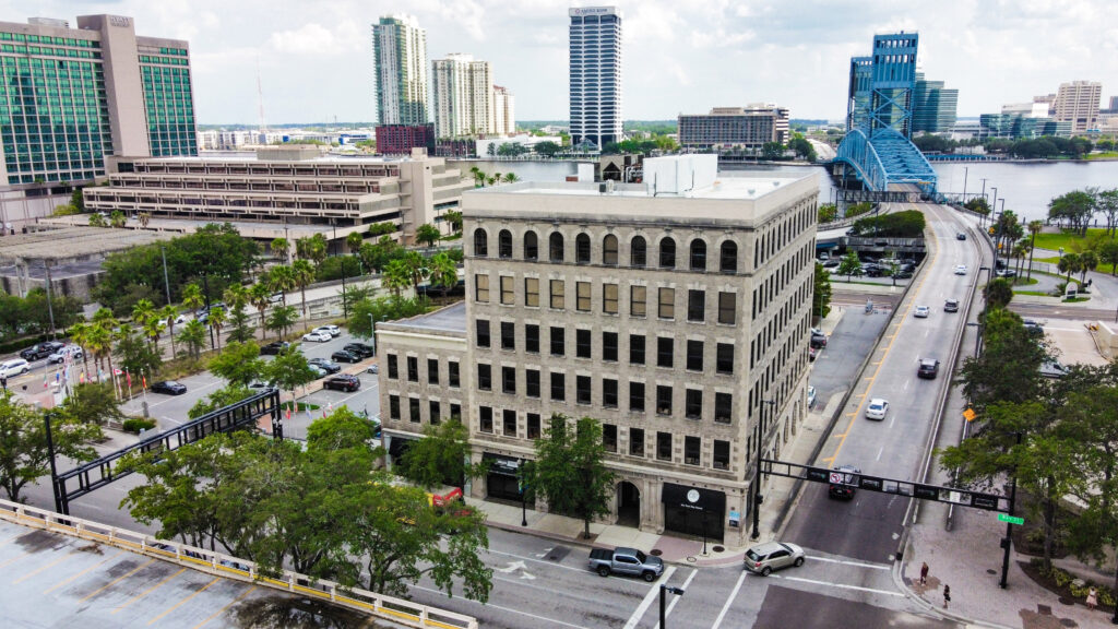 Flyover view of downtown Jacksonville Florida looking south over East Bay Street with the Main Street Bridge in background